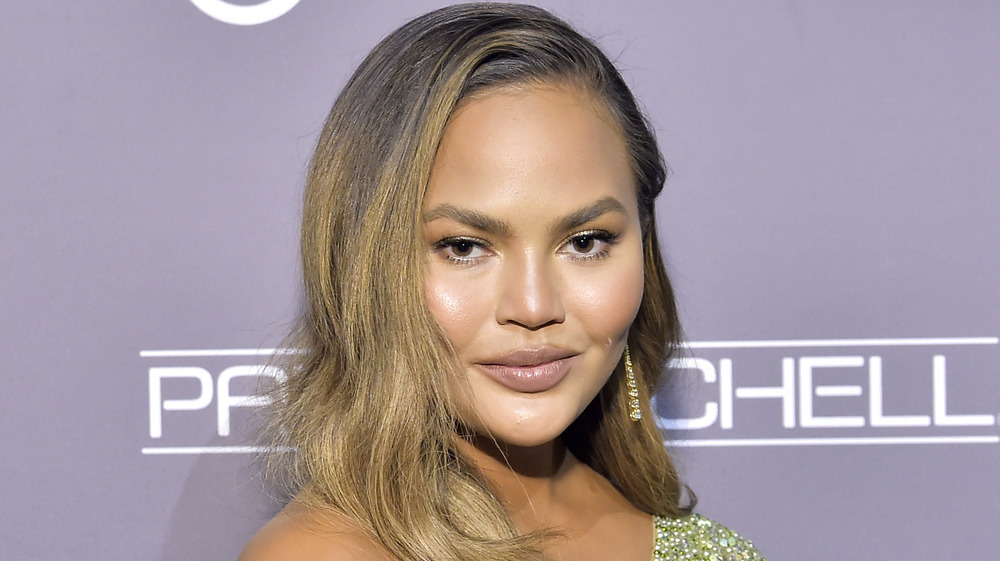 Chrissy Teigen smirking