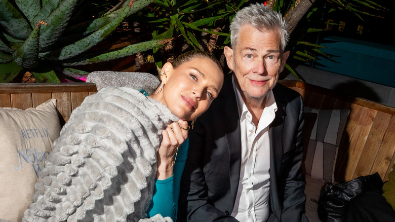 Sara and David Foster pose together at a premiere for "Nobody Wants This."