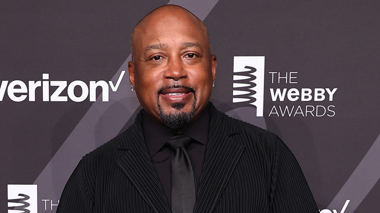 Daymond John wearing black