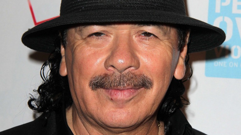 Carlos Santana posing