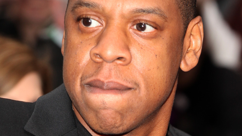 Jay-Z with a neutral expression