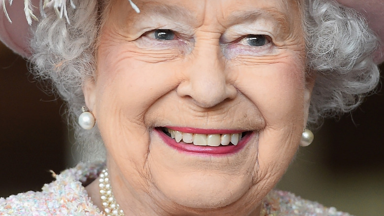 Queen Elizabeth smiles at an engagement