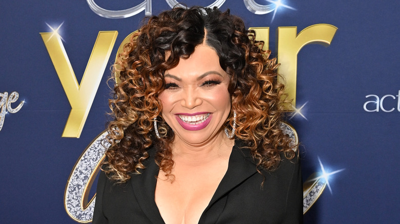 Tisha Campbell smiles