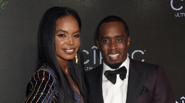Kim Porter and Diddy smiling