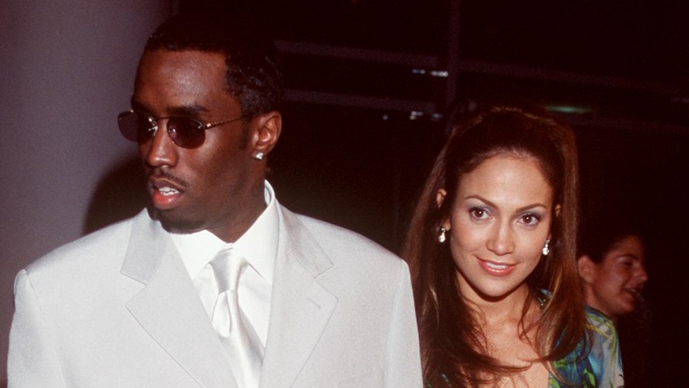 Sean Combs, Jennifer Lopez holding hands at the 2000 Grammys