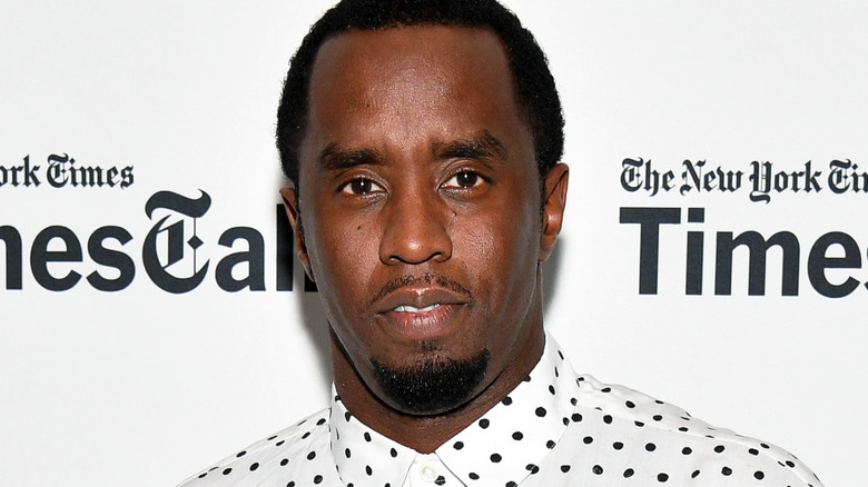 Sean "Diddy" Combs smiling in close-up at red carpet event