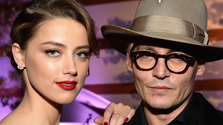 Johnny Depp and Amber Heard posing