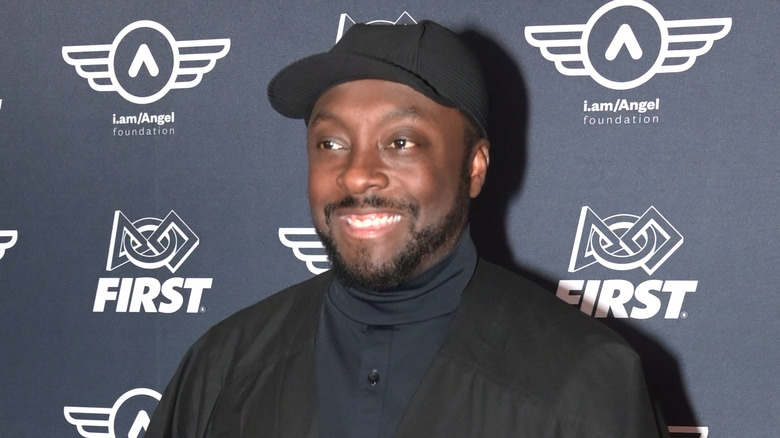 Will.i.am smiling