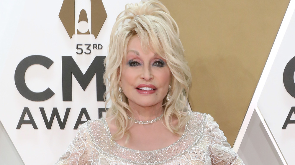 Dolly Parton posing on red carpet