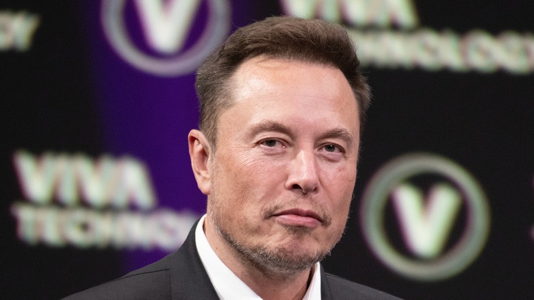 Elon Musk gray suit