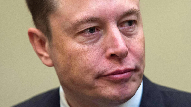Elon Musk with a serious expression