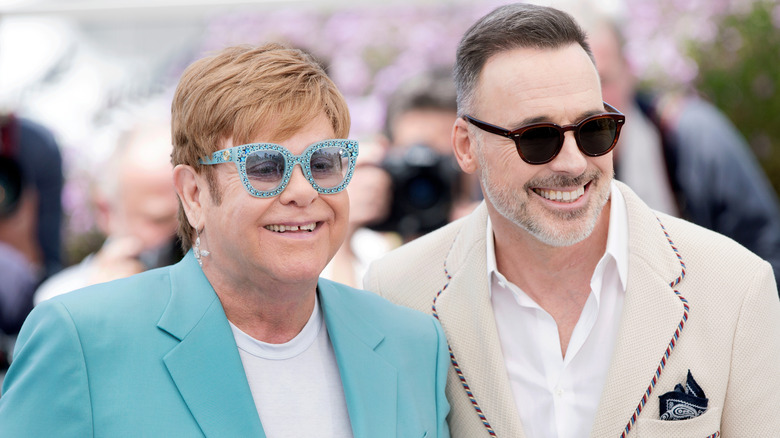 Elton John and David Furnish smiling