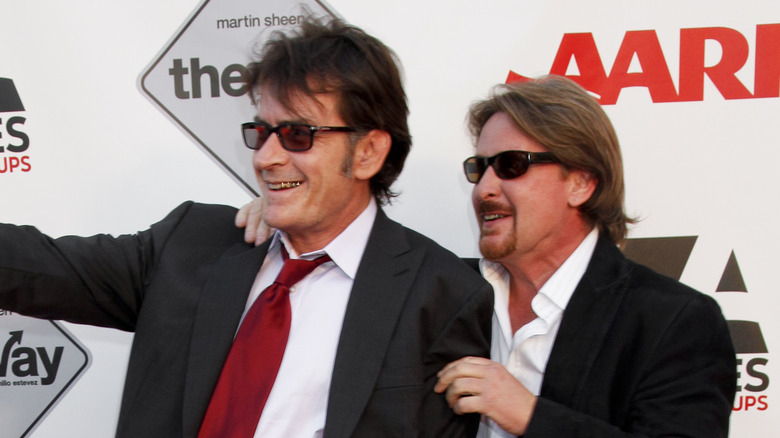 Charlie Sheen and Emilio Estevez laughing together