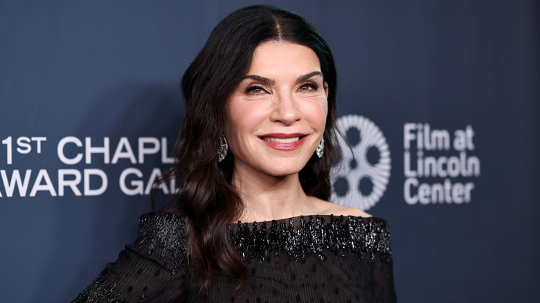 Close-up photo of Julianna Margulies on the red carpet in a beaded black dress.