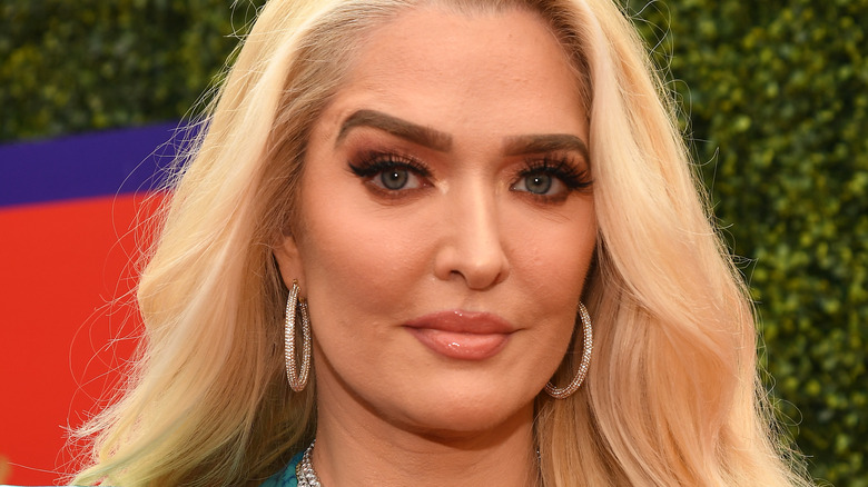 Erika Jayne, 2021 MTV awards, blond hair down, not smiling, wearing hoops