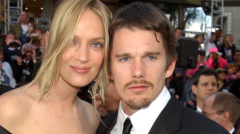 ethan hawke and uma thurman attending the academy awards show 