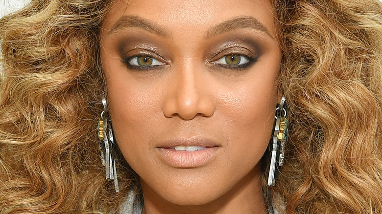 Tyra Banks wearing earrings