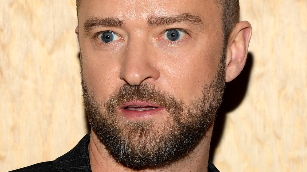 Justin Timberlake staring into the distance with a blank look