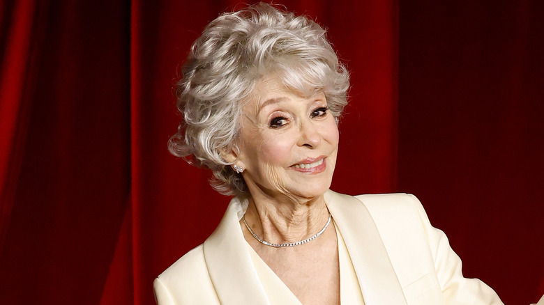 Rita Moreno poses with arms open in 2024