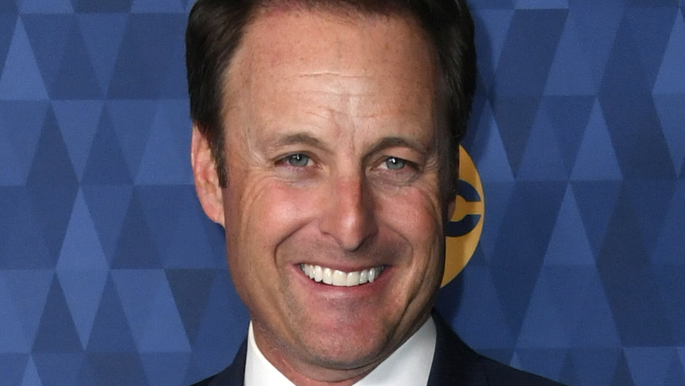 Chris Harrison smiling on the red carpet