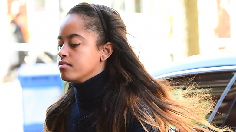 Malia Obama exits a car