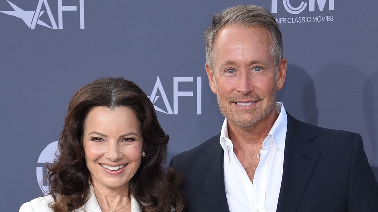 Fran Drescher and Peter Marc Jacobson smiling