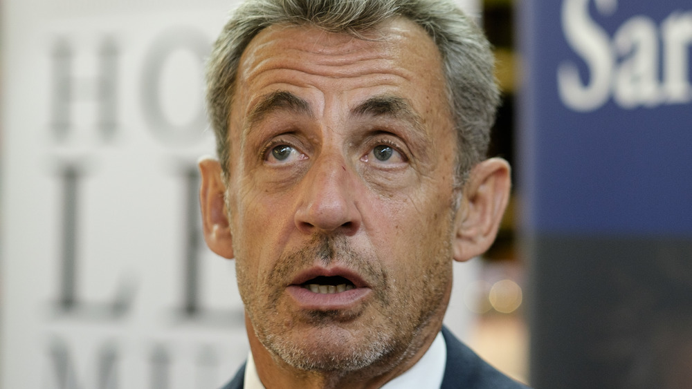 Former French President Nicolas Sarkozy signs his latest book "le temps des tempetes" in a bookstore on September 3, 2020 in Brussels, Belgium.