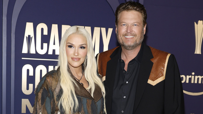 Gwen Stefani and Blake Shelton wearing leather-trimmed jackets at the ACM Awards