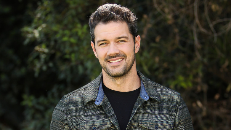 Ryan Paevey smiling outdoors