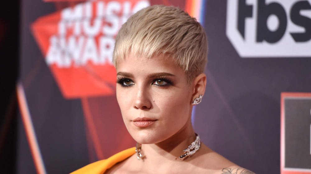Halsey with a serious expression
