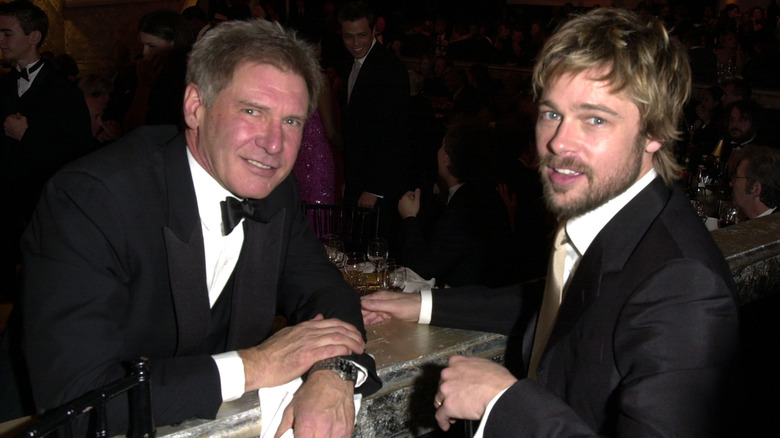 Harrison Ford and Brad Pitt posing in 2002