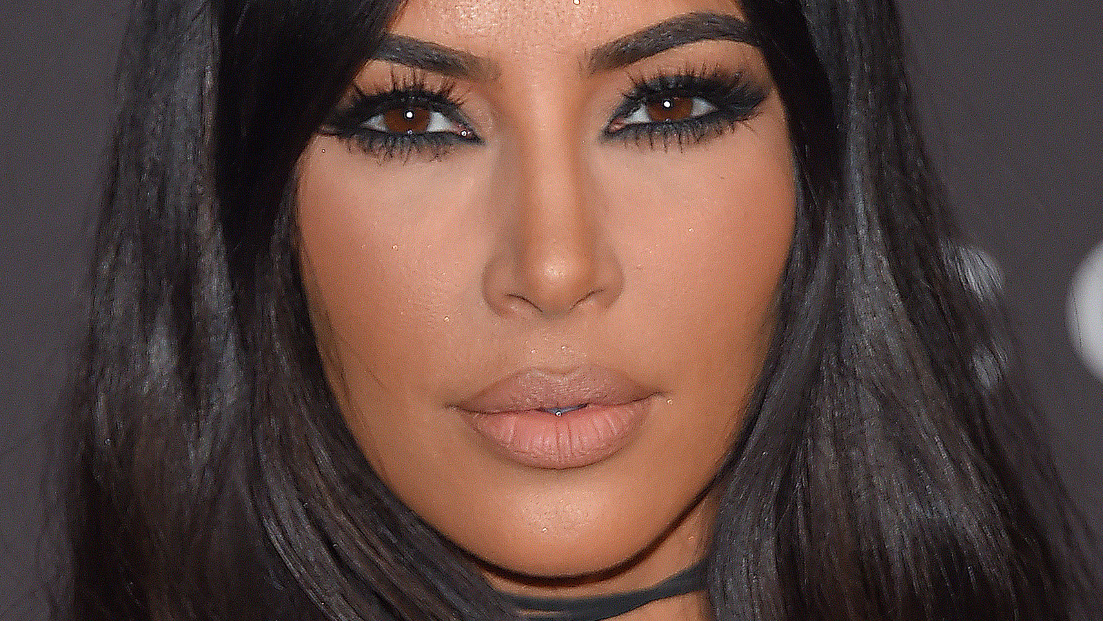 Why Has Kim Kardashian Been Completely Covering Her Face Lately?