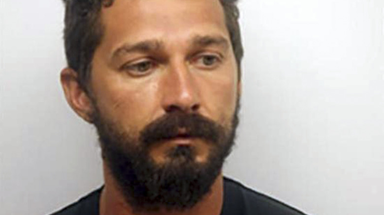 Shia LaBeouf posing for a mugshot