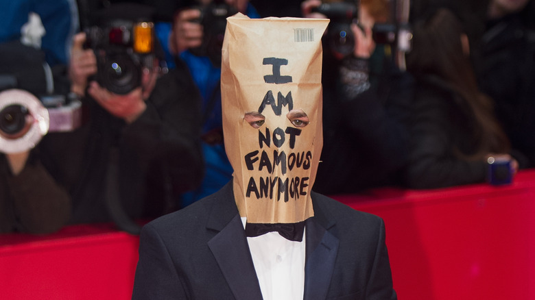 Shia LaBeouf posing with a paper bag