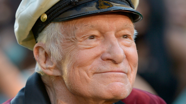 Hugh Hefner smiles at an event