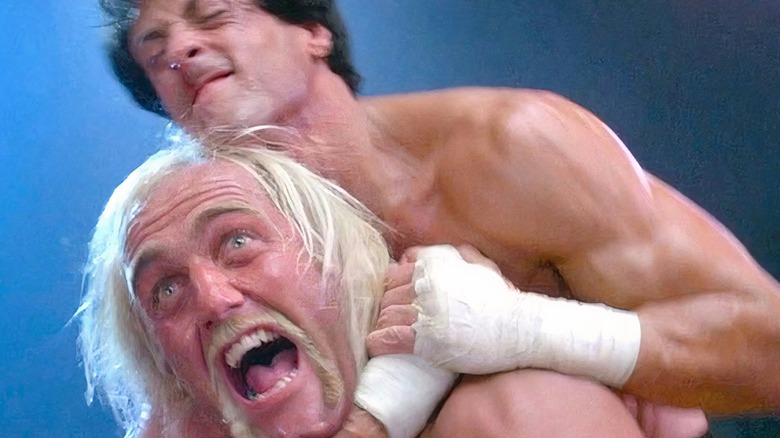 Rocky Balboa holding Thunderclips in a choke hold during an exhibition charity event in Rocky III