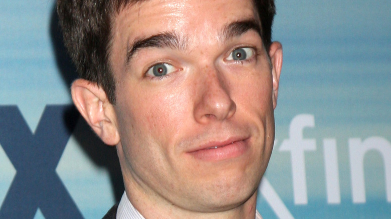 John Mulaney smiling eyes big