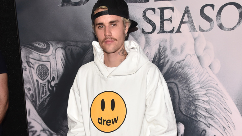 Justin Bieber proudly bears his Drew House brand during the UFC