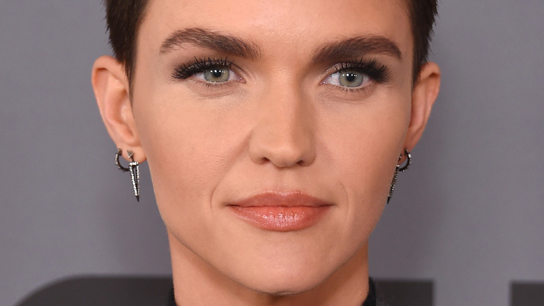 Ruby Rose poses with silver earrings