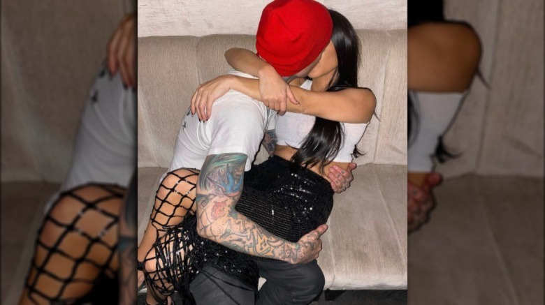 Travis Barker and Kourtney Kardashian kissing