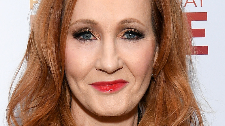 JK Rowling smiling gold eyeshadow red lipstick