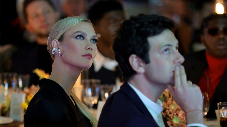 Karlie Kloss and Joshua Kushner looking up