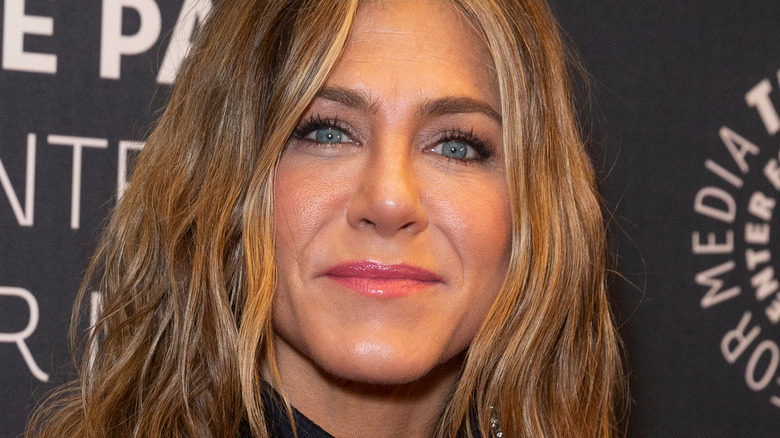 Jennifer Aniston smiling lips closed