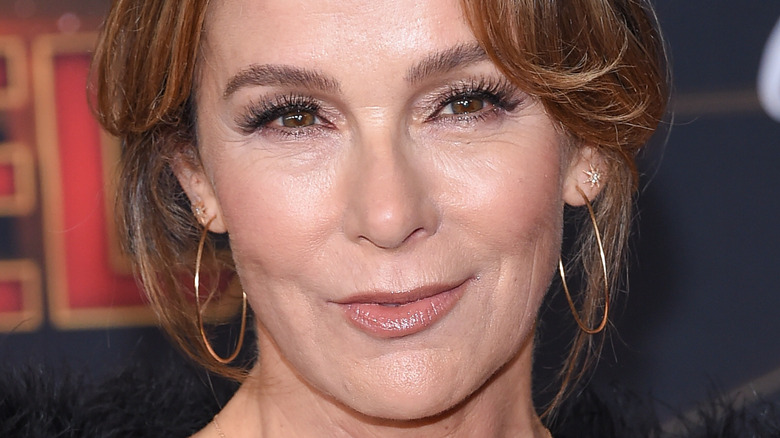 Jennifer Grey poses in gold hoop earrings