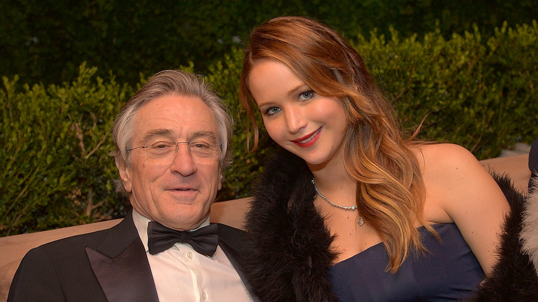 Robert De Niro sits with Jennifer Lawrence