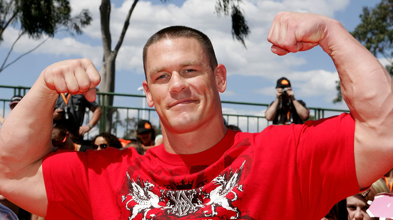 John Cena smiling and flexing arms