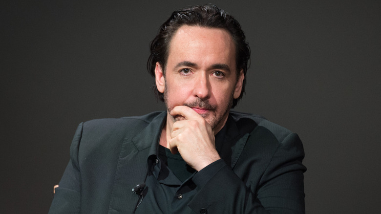 John Cusack poses in 2015