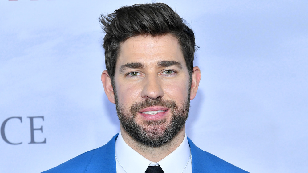 John Krasinski smiling on the red carpet