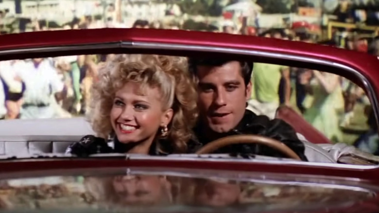 Olivia Newton-John, John Travolta in convertible 