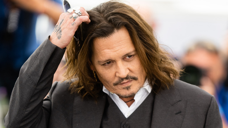 Johnny Depp scratching head